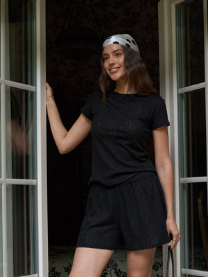 MUSSONY black lace top with short sleeves in a lyocell blend