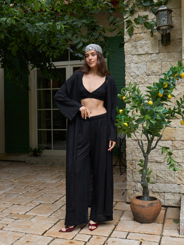 Black lace kimono styled as a summer resort layer