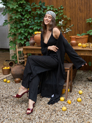 Black lace kimono draping over the full length of the leg