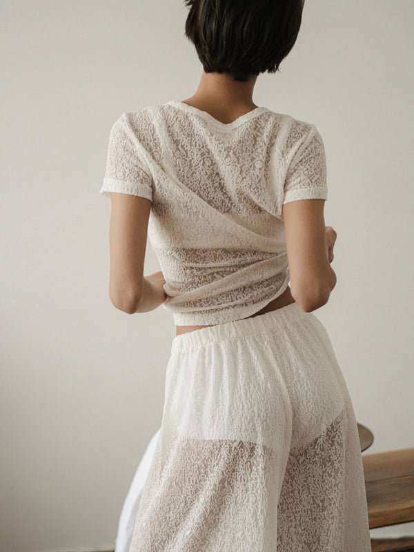 Ecru lace short-sleeve top by MUSSONY — shown with matching pieces